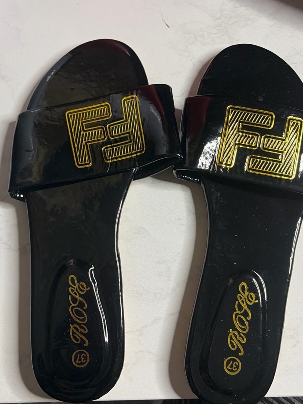 Women’s Black Slide Sandals with Gold Logo Accent
